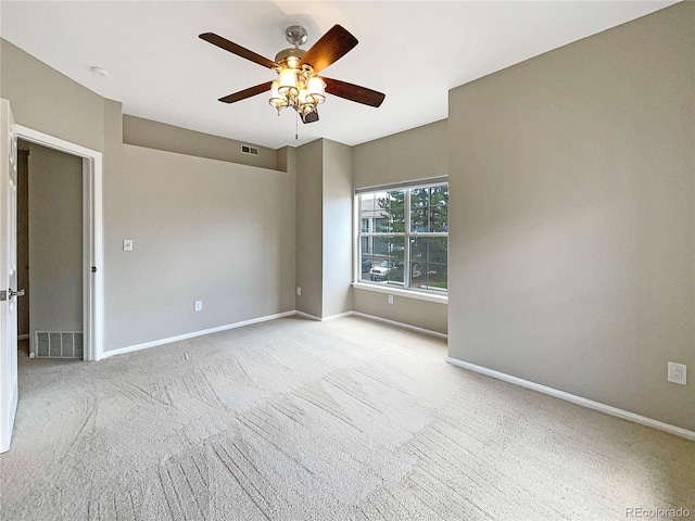 carpeted empty room with ceiling fan