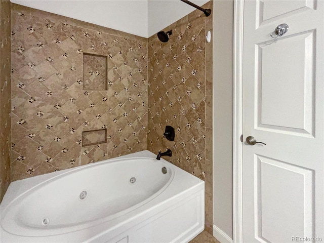 bathroom with tile walls and bathing tub / shower combination