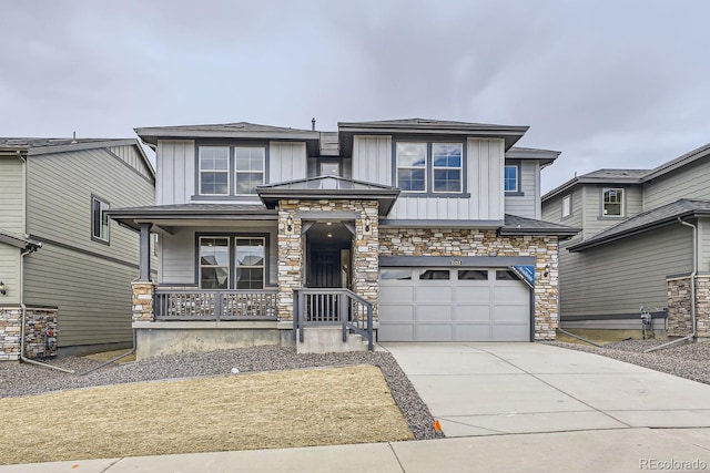 view of front of home featuring covered porch and a garage