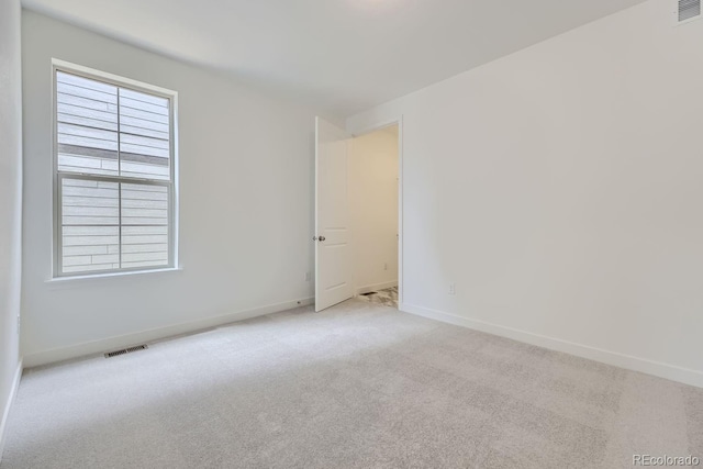 view of carpeted spare room