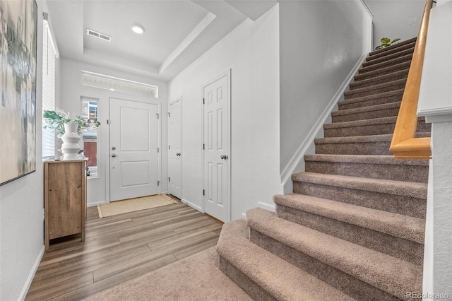 4060 N Rome St, Aurora, CO 80019 - entrance foyer featuring stairway, wood finished floors, a raised ceiling, baseboards, and recessed lighting