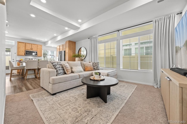 4060 N Rome St, Aurora, CO 80019 - living area featuring recessed lighting, light colored carpet, and baseboards