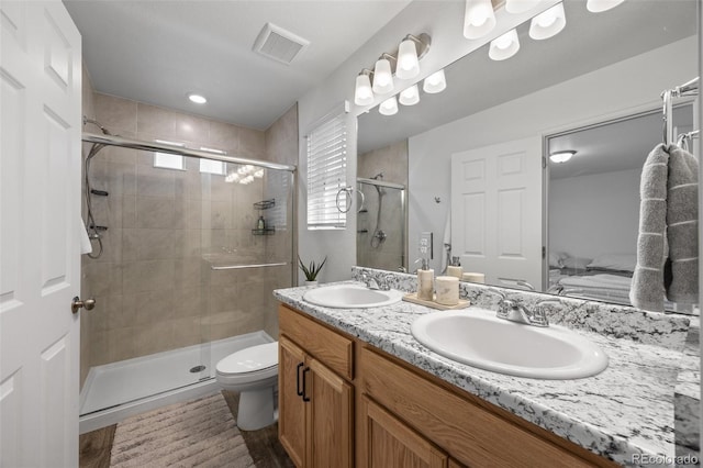 4060 N Rome St, Aurora, CO 80019 - ensuite bathroom with double vanity, a shower stall, and toilet
