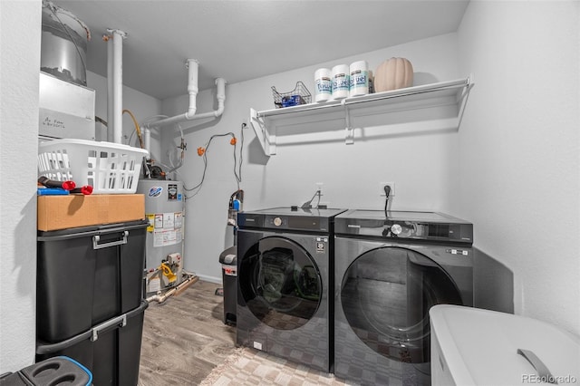 4060 N Rome St, Aurora, CO 80019 - laundry room featuring water heater, washer and dryer, and wood finished floors