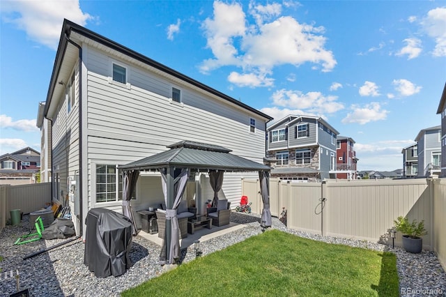 4060 N Rome St, Aurora, CO 80019 - back of property with a gazebo, a patio area, outdoor lounge area, and a residential view
