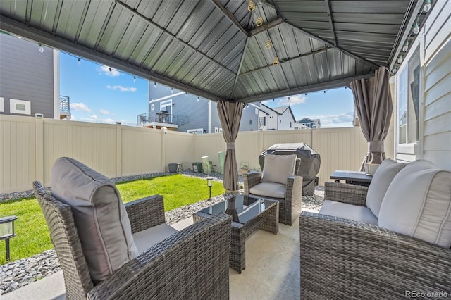 4060 N Rome St, Aurora, CO 80019 - fenced backyard featuring an outdoor hangout area, a patio area, a grill, and a gazebo