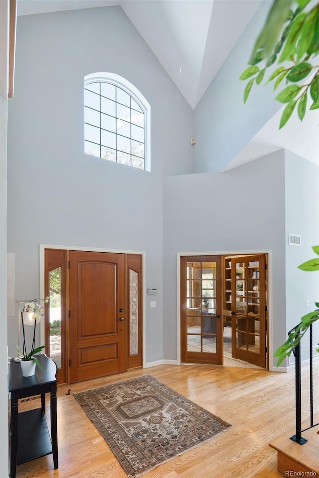 2345 Spotswood Pl, Boulder, CO 80304 - entryway with high vaulted ceiling, wood finished floors, plenty of natural light, and baseboards