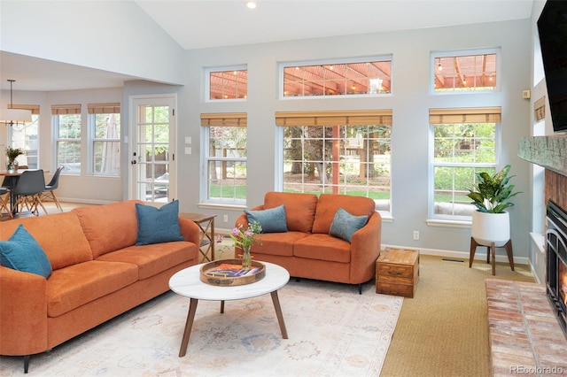 2345 Spotswood Pl, Boulder, CO 80304 - living area featuring a brick fireplace, baseboards, high vaulted ceiling, light carpet, and recessed lighting