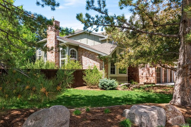 2345 Spotswood Pl, Boulder, CO 80304 - view of front of property with brick siding, a chimney, and a shingled roof