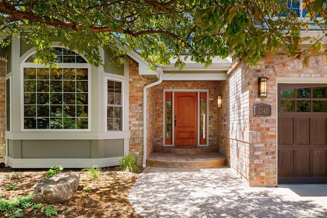 2345 Spotswood Pl, Boulder, CO 80304 - entrance to property with an attached garage and brick siding