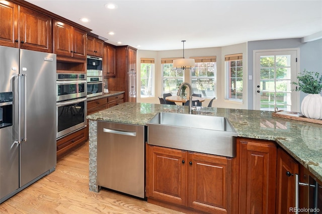 2345 Spotswood Pl, Boulder, CO 80304 - kitchen with appliances with stainless steel finishes, a sink, light wood-type flooring, plenty of natural light, and recessed lighting