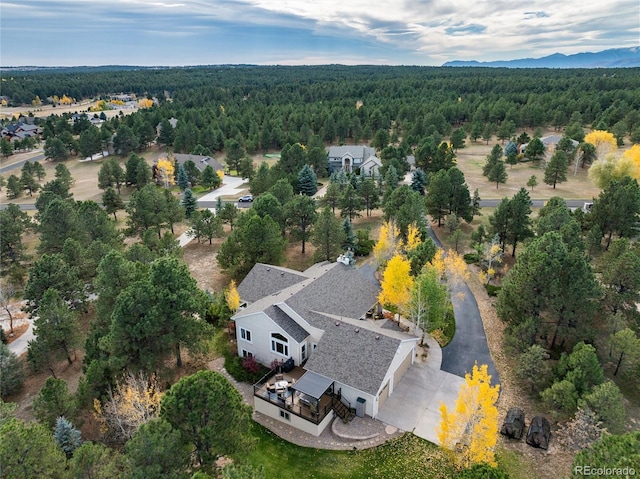 bird's eye view featuring a forest view