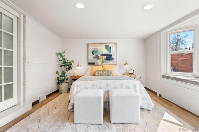 bedroom featuring recessed lighting and light wood finished floors