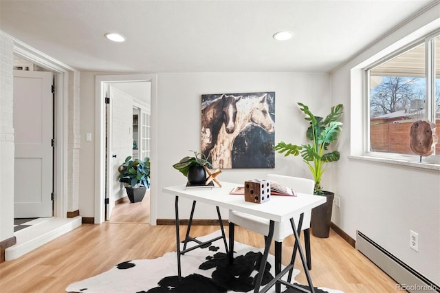 office area featuring light wood-style flooring, recessed lighting, baseboards, and a baseboard radiator