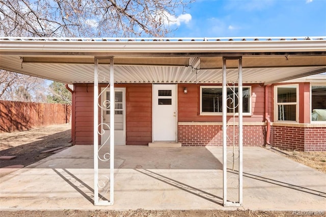 property entrance featuring fence