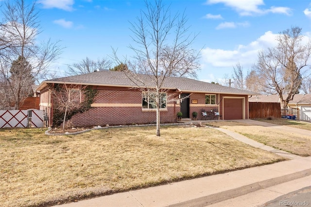 single story home with a front yard and fence