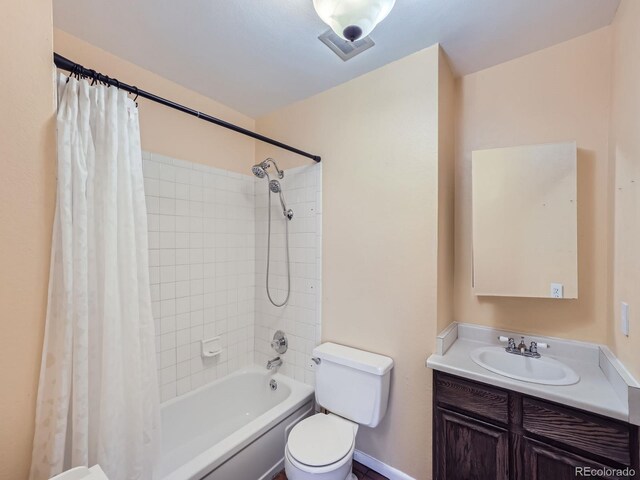 full bathroom featuring vanity, toilet, and shower / bath combo with shower curtain