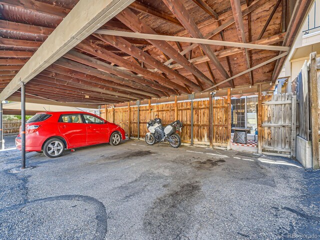 garage featuring a carport