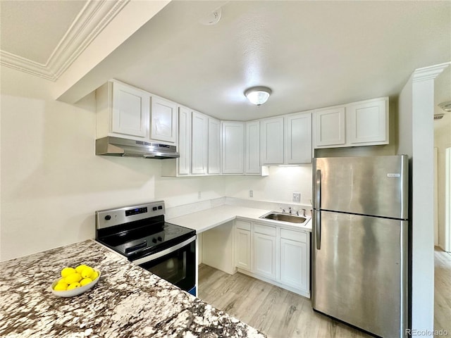 kitchen with crown molding, appliances with stainless steel finishes, white cabinetry, and under cabinet range hood