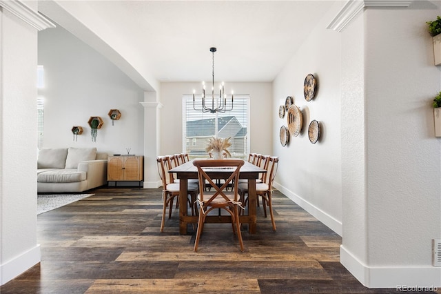 dining area with baseboards, dark wood finished floors, visible vents, and an inviting chandelier