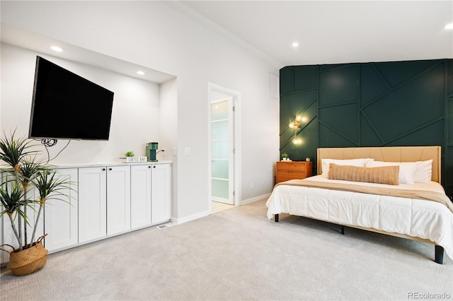 bedroom with recessed lighting, light carpet, and baseboards