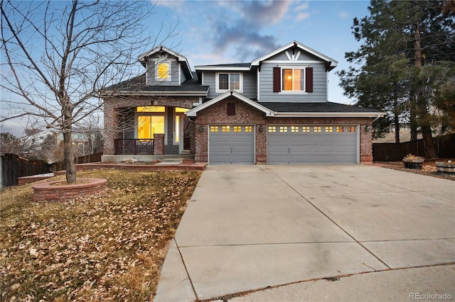 view of front of home featuring fence, driveway, covered porch, brick siding, and a garage