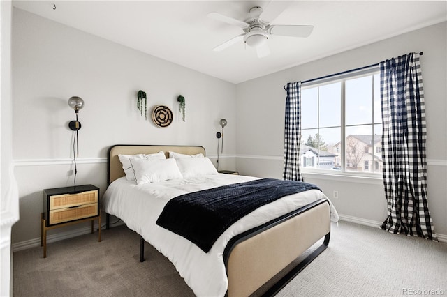 carpeted bedroom with baseboards and a ceiling fan