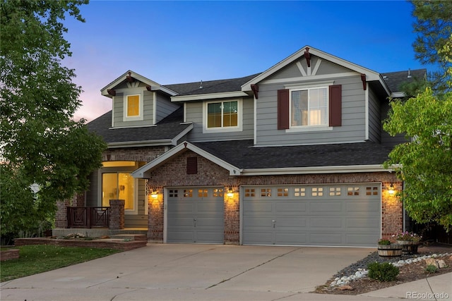 10039 Heatherwood Pl, Highlands Ranch, CO 80126 - craftsman-style house featuring driveway, brick siding, covered porch, an attached garage, and roof with shingles
