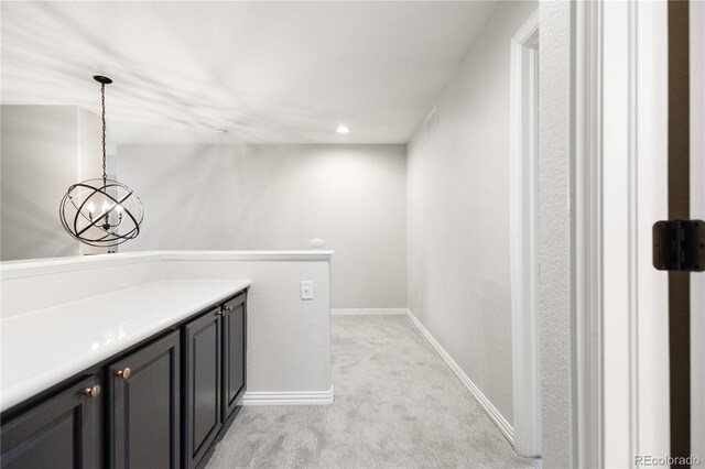 10039 Heatherwood Pl, Highlands Ranch, CO 80126 - laundry room with light colored carpet, visible vents, recessed lighting, a chandelier, and baseboards