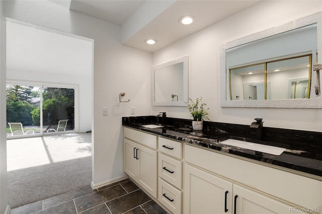 8543 Redstone St, Highlands Ranch, CO 80126 - bathroom featuring double vanity and recessed lighting
