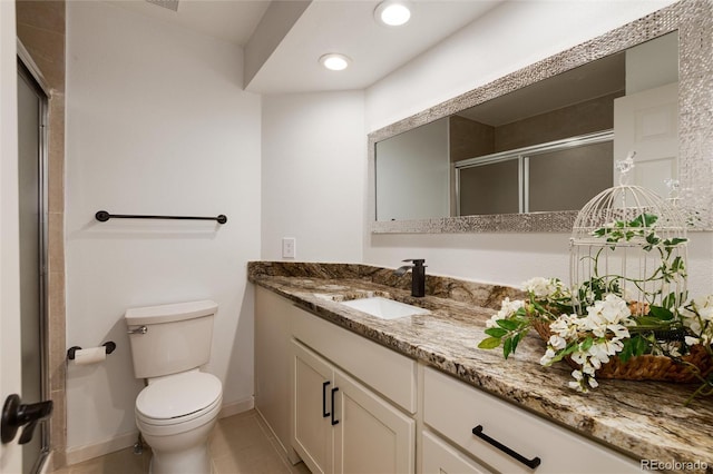 8543 Redstone St, Highlands Ranch, CO 80126 - bathroom with vanity, a stall shower, tile patterned floors, and recessed lighting