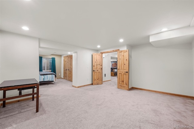 interior space featuring baseboards, light colored carpet, and recessed lighting