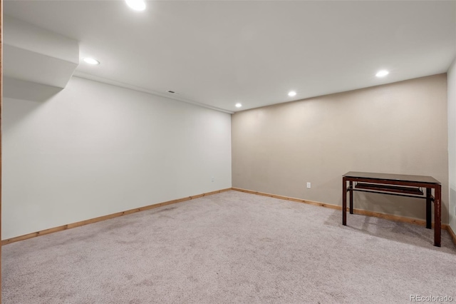 basement with carpet floors, baseboards, and recessed lighting