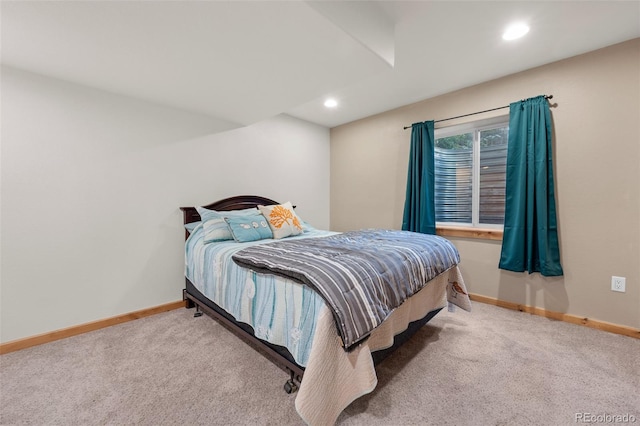 bedroom with light colored carpet