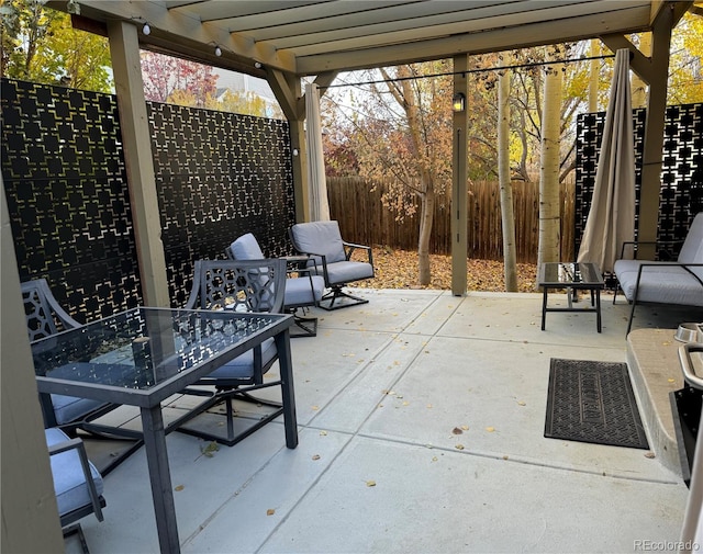 view of patio / terrace featuring outdoor dining area, a fenced backyard, and a pergola