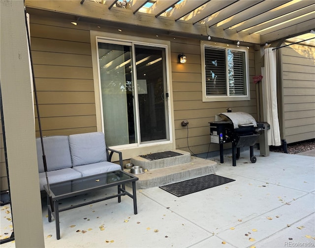 view of patio with an outdoor hangout area, grilling area, and a pergola