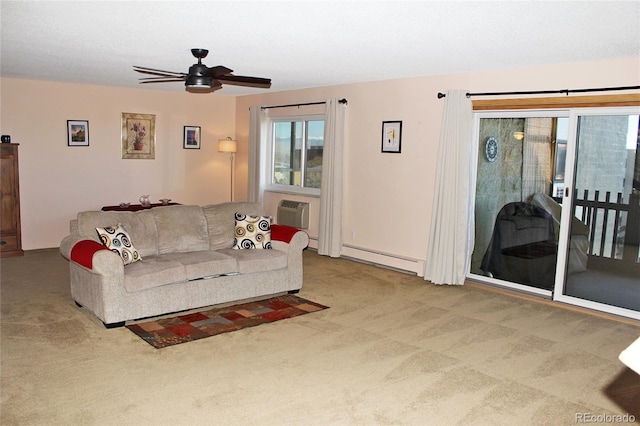 living area with ceiling fan, carpet floors, a baseboard radiator, and a wall unit AC