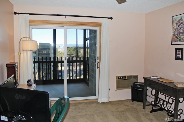 entryway featuring a wall unit AC, a textured ceiling, and carpet flooring