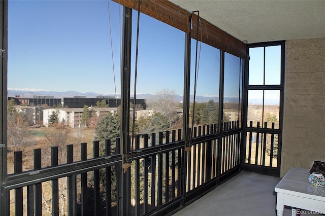 sunroom with a mountain view