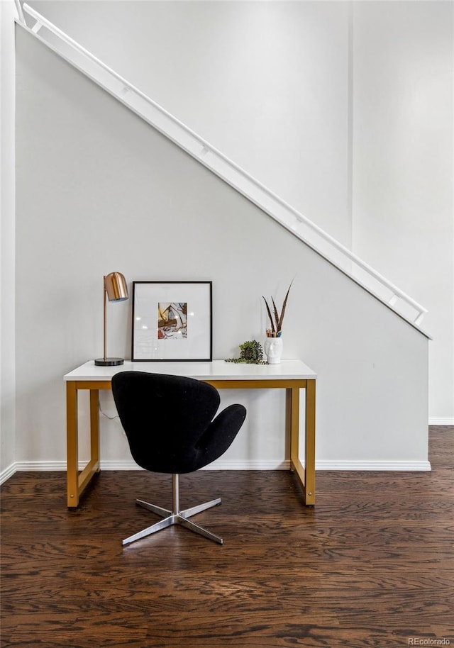 office space featuring baseboards and dark wood finished floors