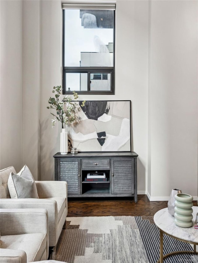 sitting room featuring wood finished floors and baseboards