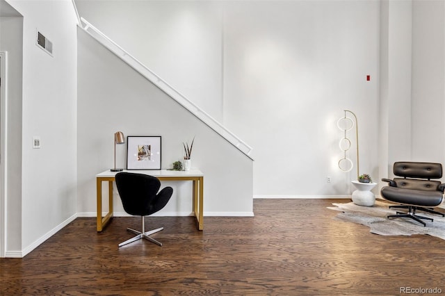 office space featuring wood finished floors and baseboards