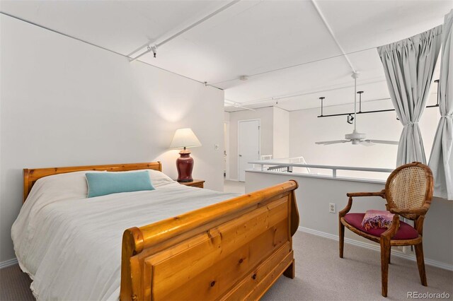 bedroom with carpet flooring and baseboards