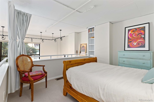 carpeted bedroom with baseboards