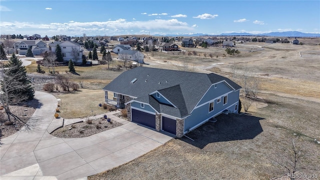 birds eye view of property with a residential view and a mountain view