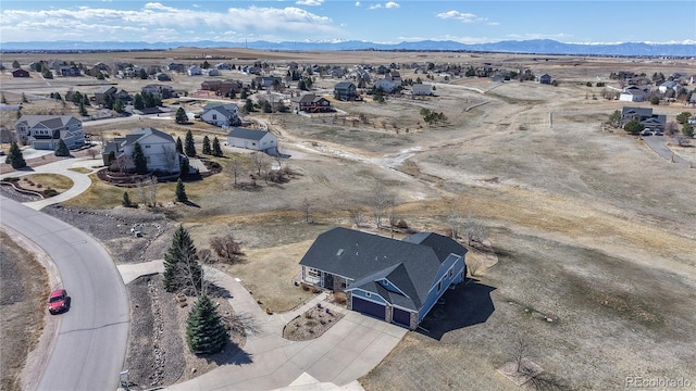 birds eye view of property with a residential view and a mountain view