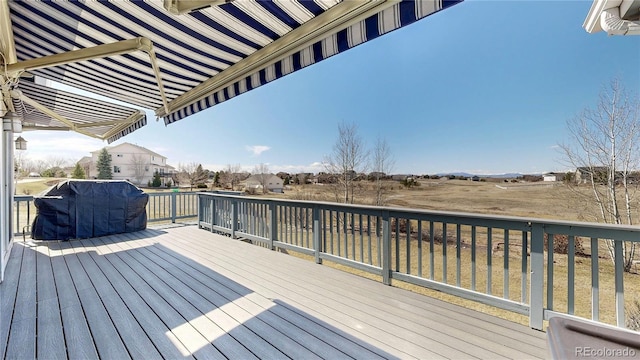 deck with a residential view and grilling area