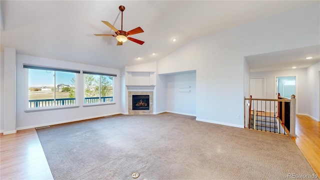 14701 Yosemite St, Brighton, CO 80602 - unfurnished living room with ceiling fan, lofted ceiling, a tile fireplace, recessed lighting, and baseboards