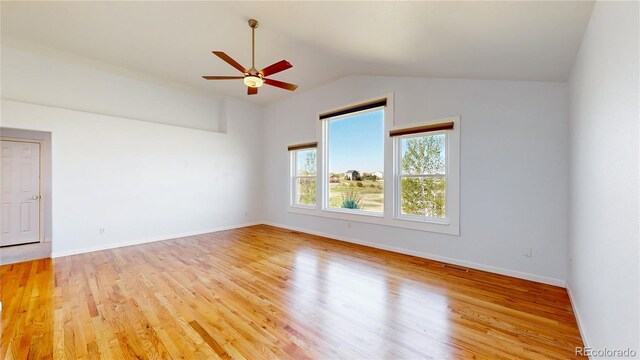 14701 Yosemite St, Brighton, CO 80602 - spare room with vaulted ceiling, ceiling fan, light wood-style flooring, and baseboards