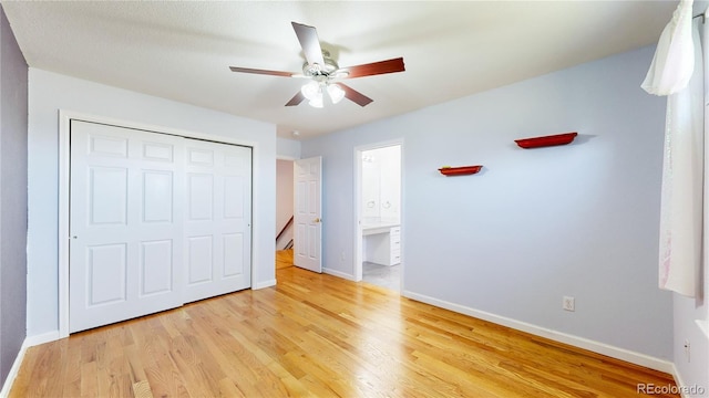14701 Yosemite St, Brighton, CO 80602 - unfurnished bedroom with light wood-style floors, baseboards, a closet, ensuite bath, and ceiling fan